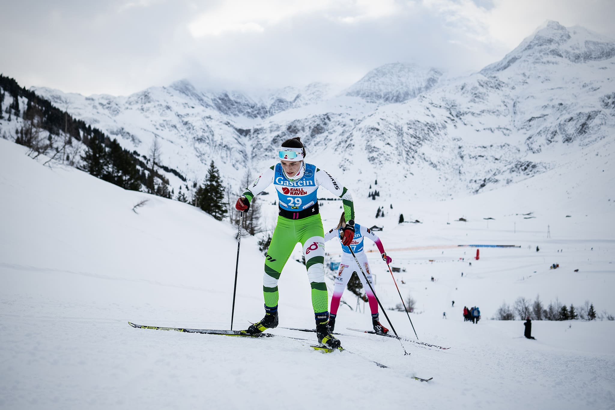 Professional skiers on a snowy mountain.